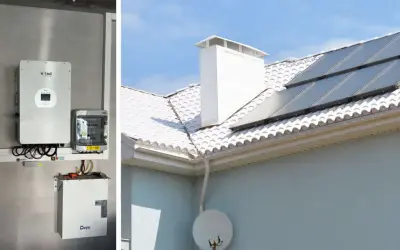 Instalacja fotowoltaiczna z panelem słonecznym na dachu i bank energii zamontowany na ścianie.