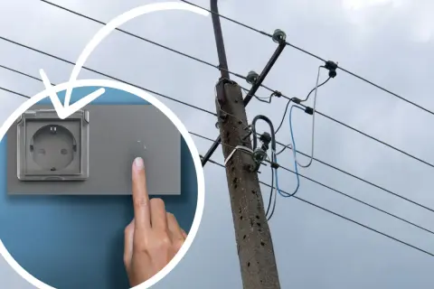 Ręka naciska przycisk obok gniazdka, sugerując koszt instalacji elektrycznej. W tle słup energetyczny z przewodami.